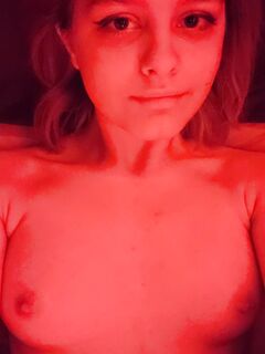 Hot girl with medium tits posing for camera