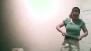 College girl changing top in bedroom