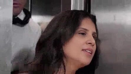 Wife stuck in elevator with husband's business partner