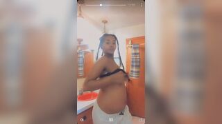 Pregnant Black Girl showing off titties for cash from Akron