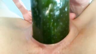 Amateur Asian teen slut masturbating with cucumber