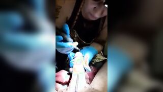 a tattoo artist sucking on her clients