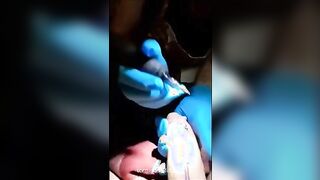 a tattoo artist sucking on her clients cock to keep it hard which is needed for the t