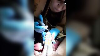 a tattoo artist sucking on her clients cock to keep it hard which is needed for the t